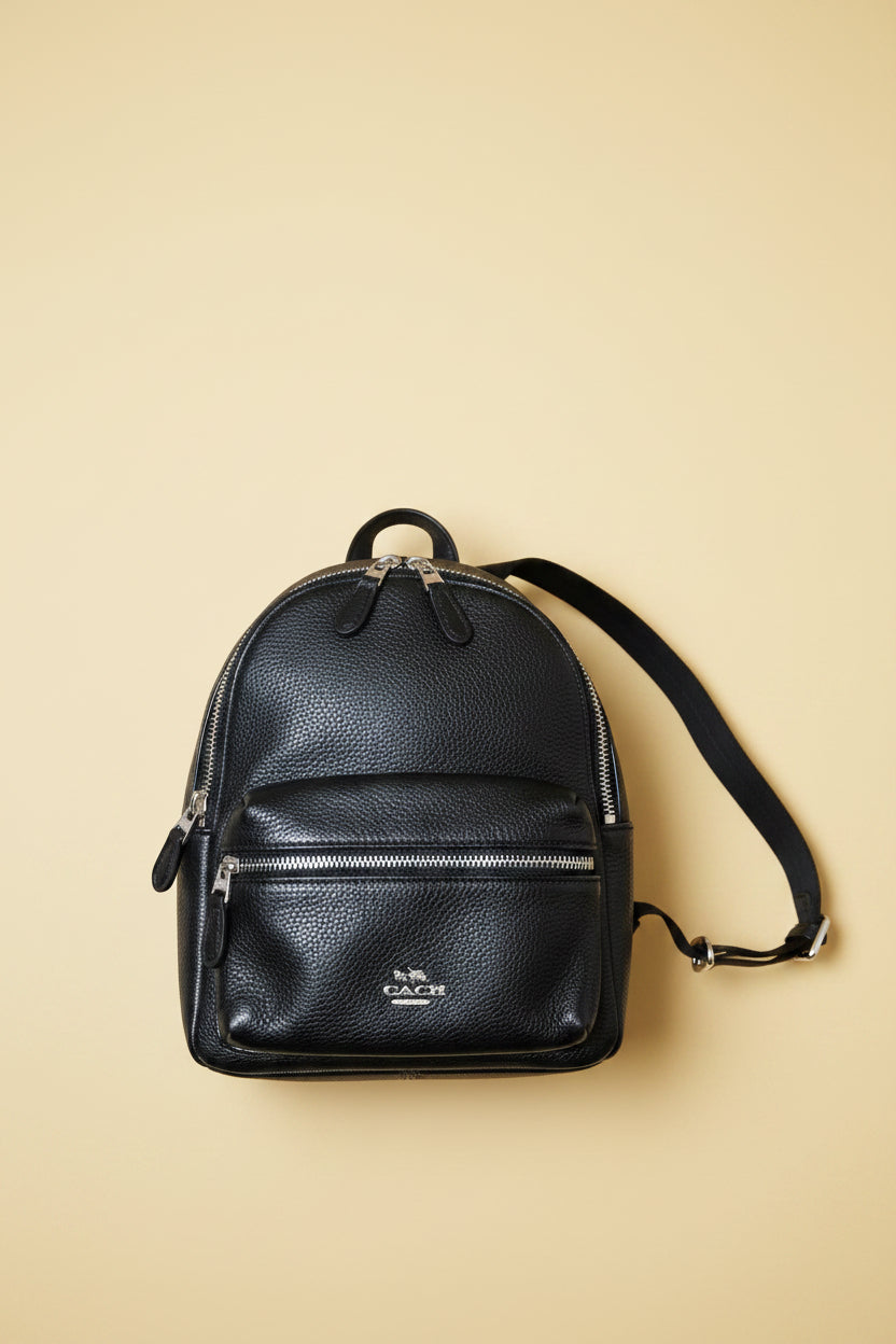 Coach black leather backpack detail view