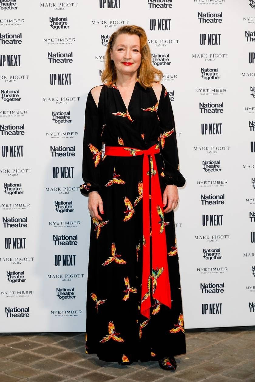 DVF parrot print jumpsuit — fabric print close-up showing tropical macaws