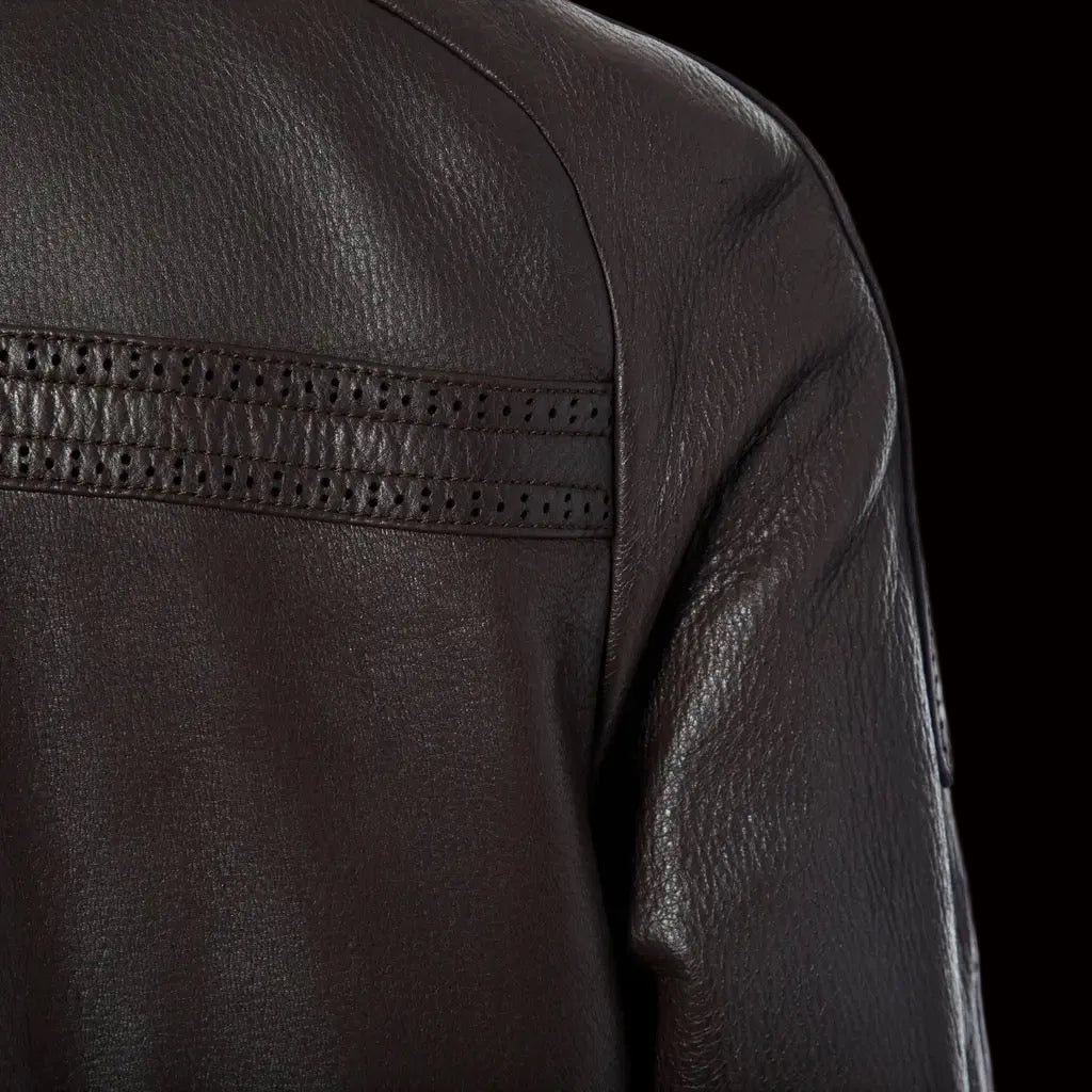Céline leather coat — close-up of perforated openwork detail at shoulder
