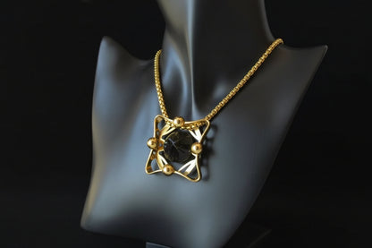 Vintage gold chain necklace with carved onyx pendant — on display bust