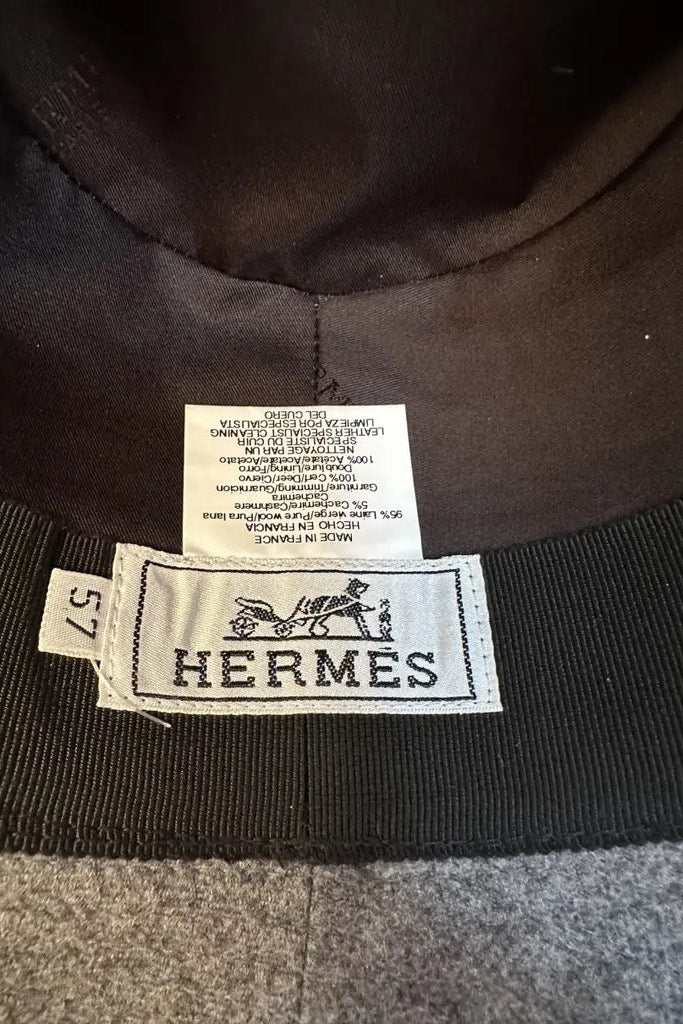 Hermès wool felt fedora interior label showing size 57, Made in France, composition details