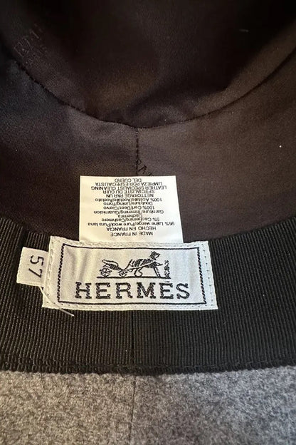 Hermès wool felt fedora interior label showing size 57, Made in France, composition details