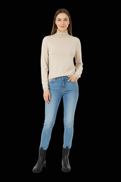 Witty Knitters cream wool turtleneck pullover front view on model