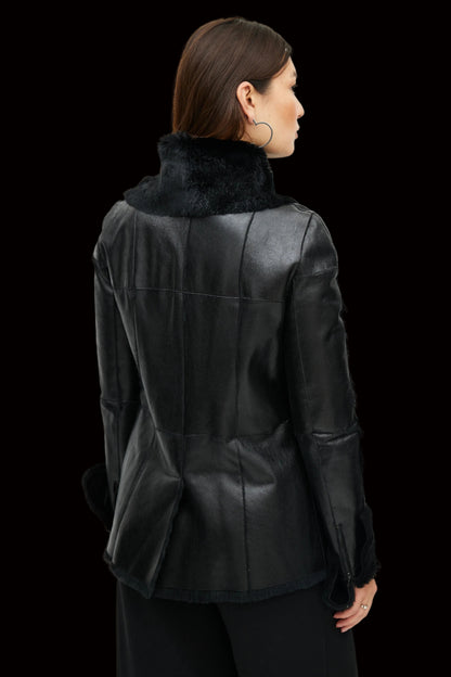 Chanel black lambskin leather jacket with shearling trim gold CC button close-up