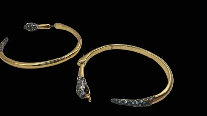Alexis Bittar pavé crystal snake hoop earrings, detail of serpent head and tail cap