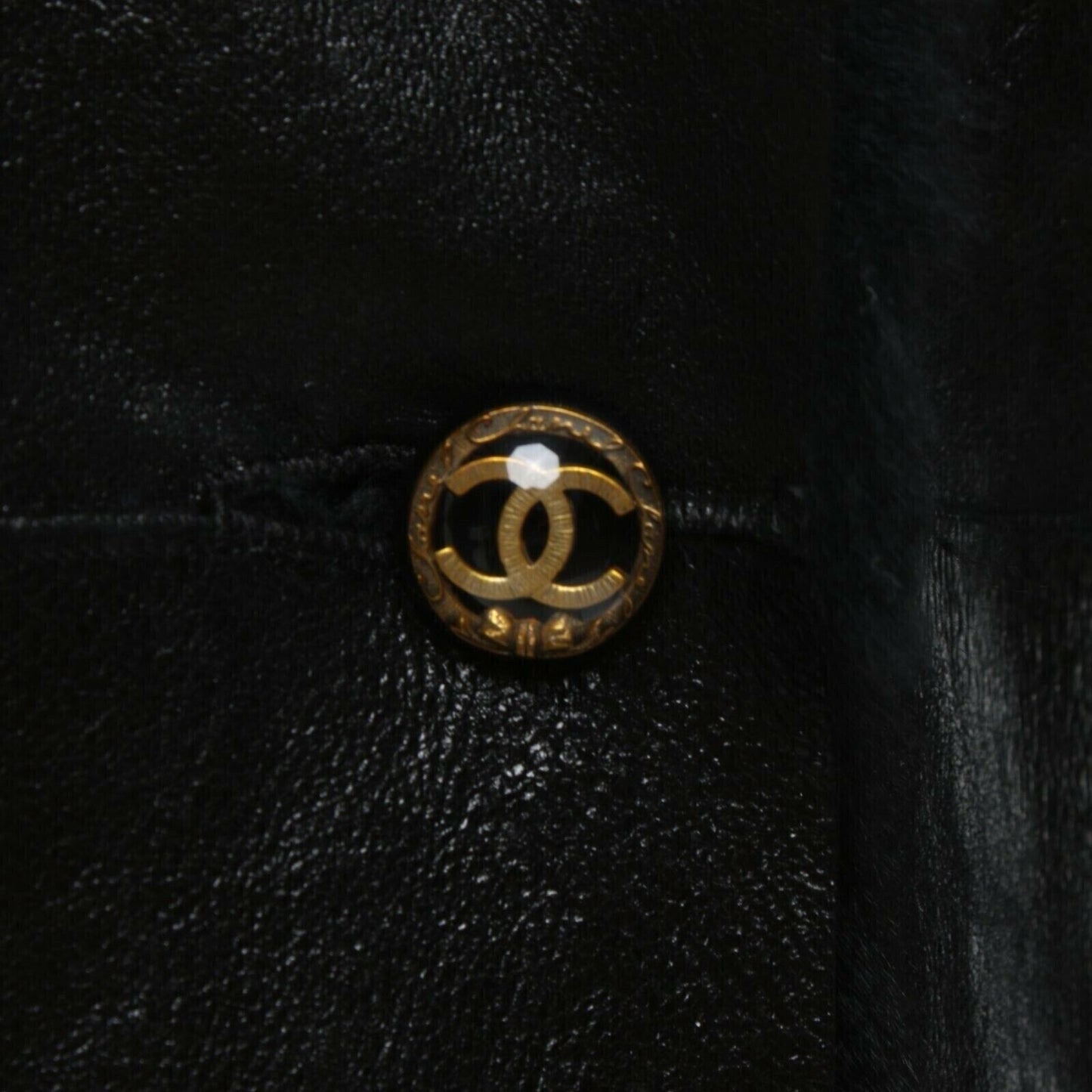 Chanel black lambskin leather jacket with shearling trim gold CC button side view
