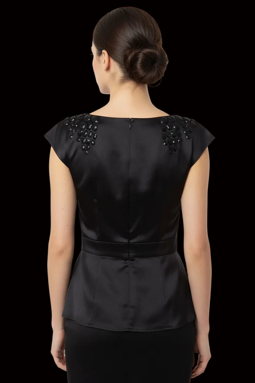 Dior embellished satin peplum top back view — silk lining visible at back zip closure