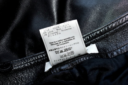 Care label — 85% Wool 15% Polyester knit cuffs, clean by leather specialist only
