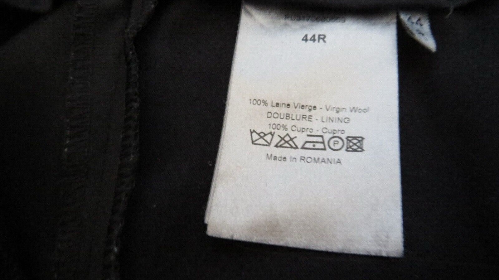 Dior care label close-up — 100% Virgin Wool, Cupro lining, Made in Romania