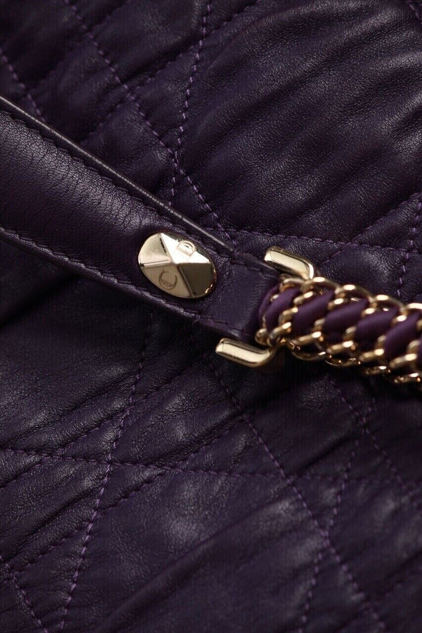 Dior Cannage bag hardware detail — gold stud closure on quilted purple lambskin