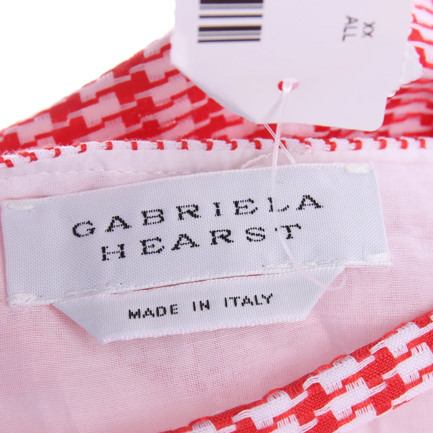 Gabriela Hearst dress close-up of red and white houndstooth fabric and button detail