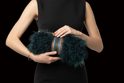Longchamp tibetan lamb fur clutch — rent from Laura Messerschmitt, Berlin stylist