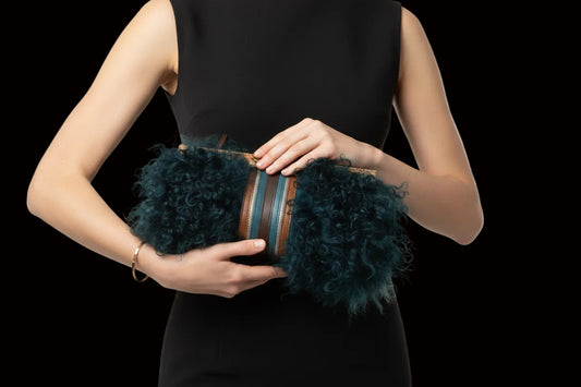 Longchamp tibetan lamb fur clutch — rent from Laura Messerschmitt, Berlin stylist